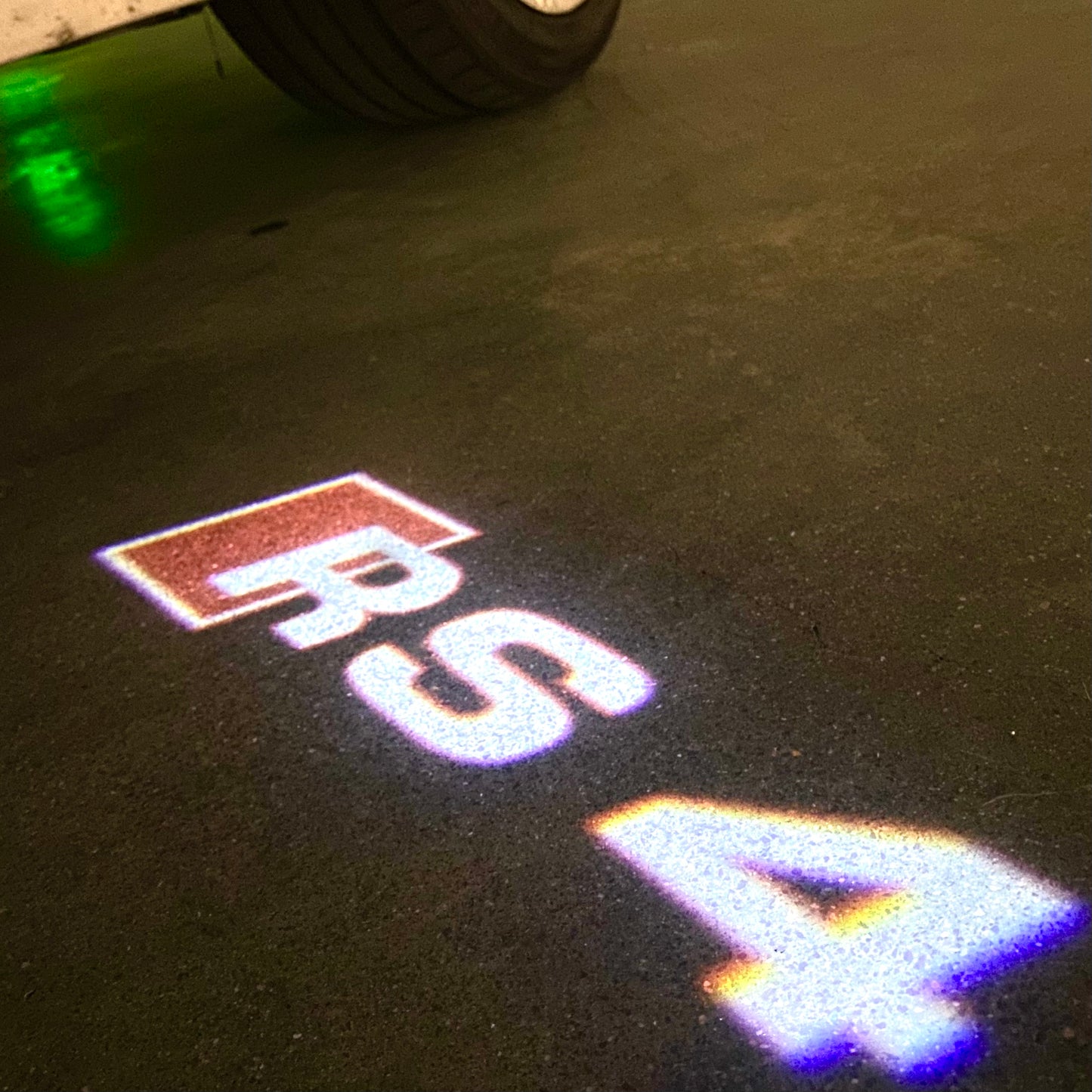 AUDI RS4 LOGO PROJECTOT LIGHTS Nr.53 (quantity 1 = 2 Logo Films /2 door lights)