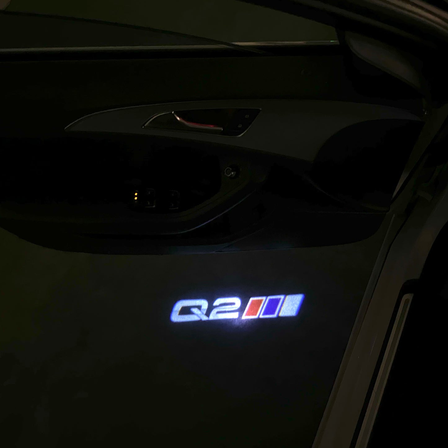 AUDI Q2 LOGO PROJECTOT LIGHTS (quantity 1 = 2 Logo Films /2 door lights)Nr.12B40