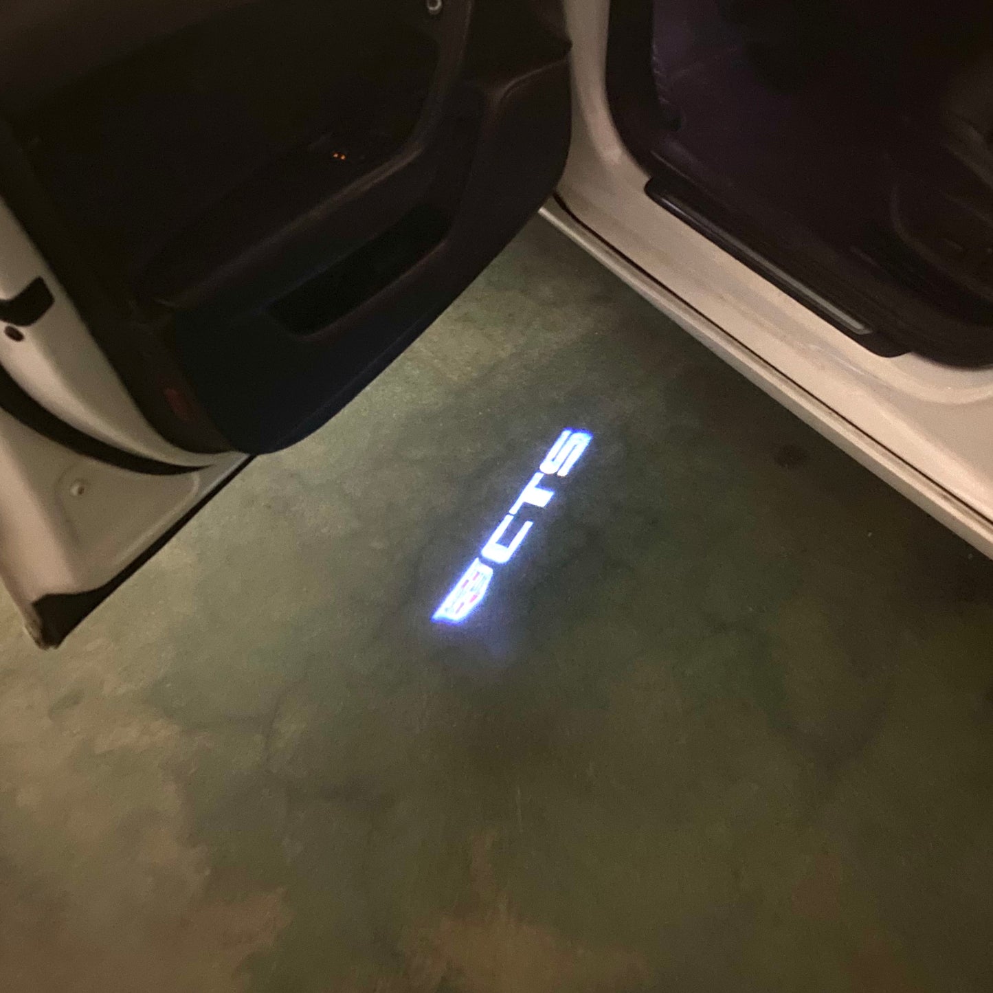 CADILLAC CTS LOGO PROJECTOT LIGHTS Nr.9799 (quantity 1 = 2 Logo Films /2 door lights)