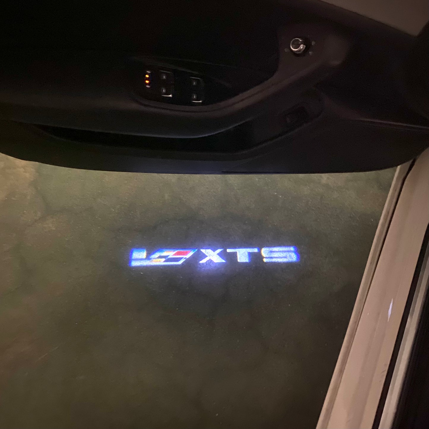 CADILLAC XTS LOGO PROJECTOT LIGHTS Nr.9802 (quantity 1 = 2 Logo Films /2 door lights)