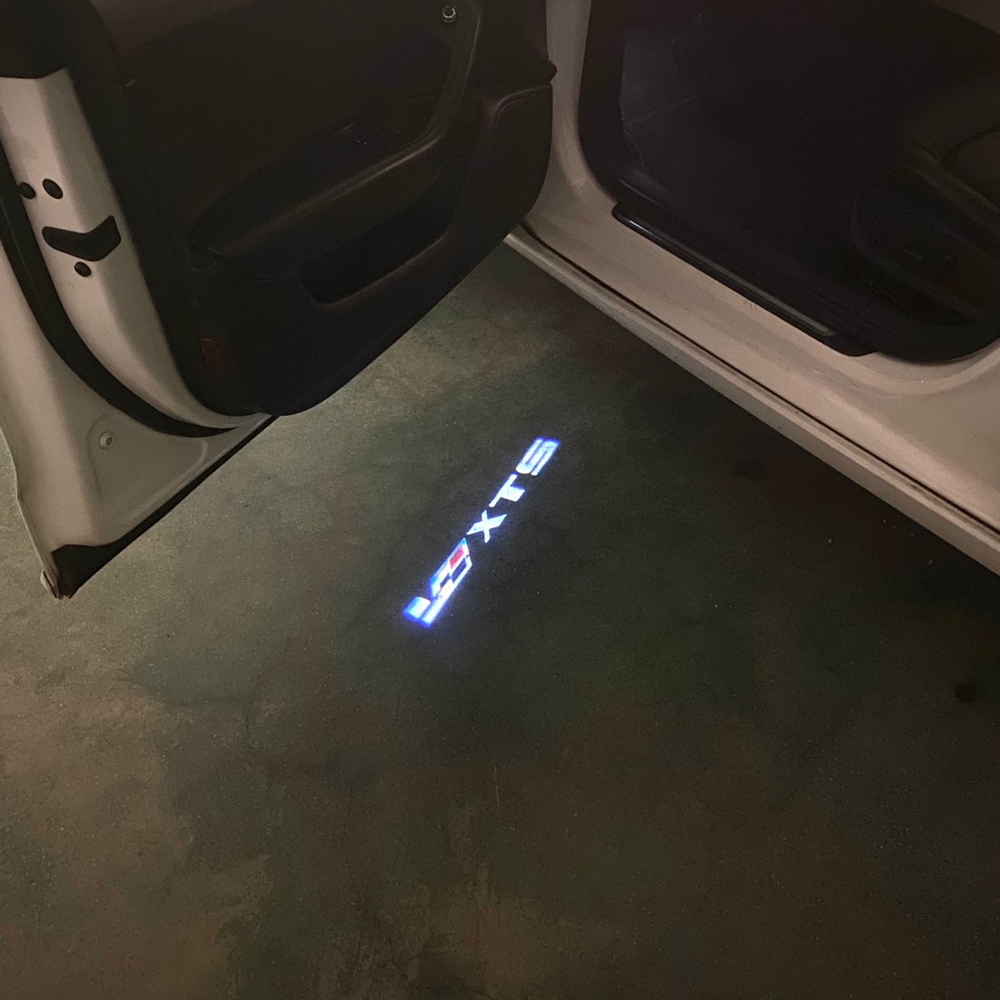 CADILLAC XTS LOGO PROJECTOT LIGHTS Nr.9802 (quantity 1 = 2 Logo Films /2 door lights)