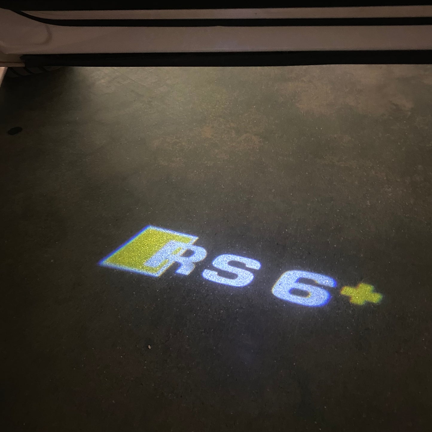 AUDI RS6+ LOGO PROJECTOT LIGHTS Nr.46Bgg (quantity 1 = 2 Logo Films /2 door lights)