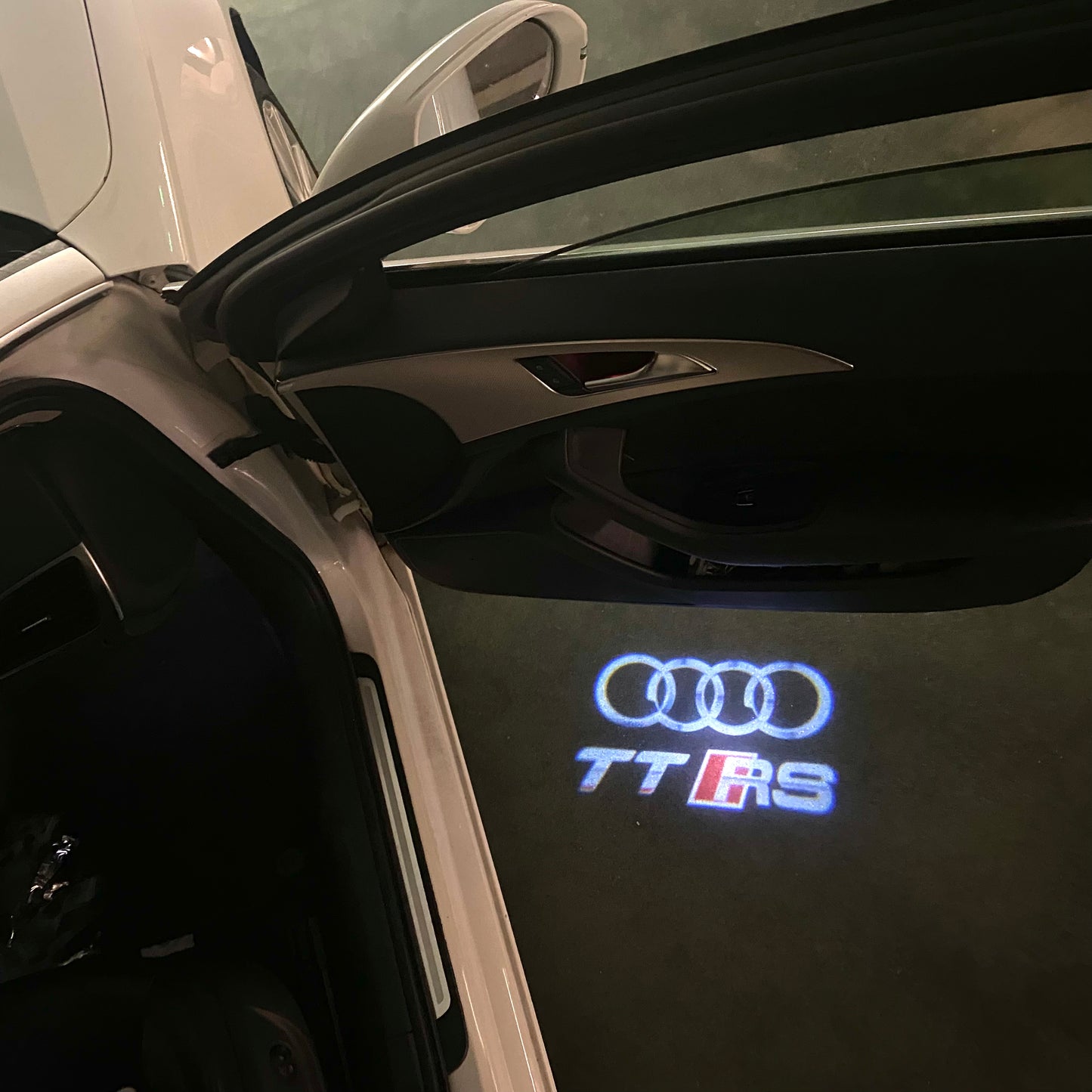 AUDI TTRS LOGO PROJECTOT LIGHTS (quantity 1 = 2 Logo Films /2 door lights)Nr.12B50