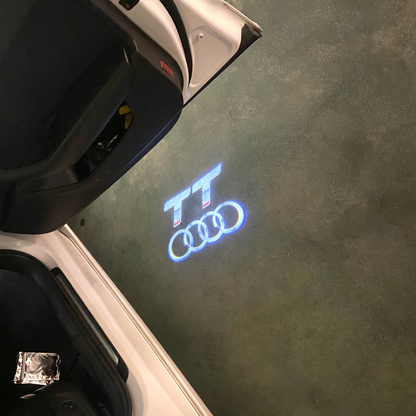 AUDI TT LOGO PROJECTOT LIGHTS (quantity 1 = 2 Logo Films /2 door lights)Nr.12B15