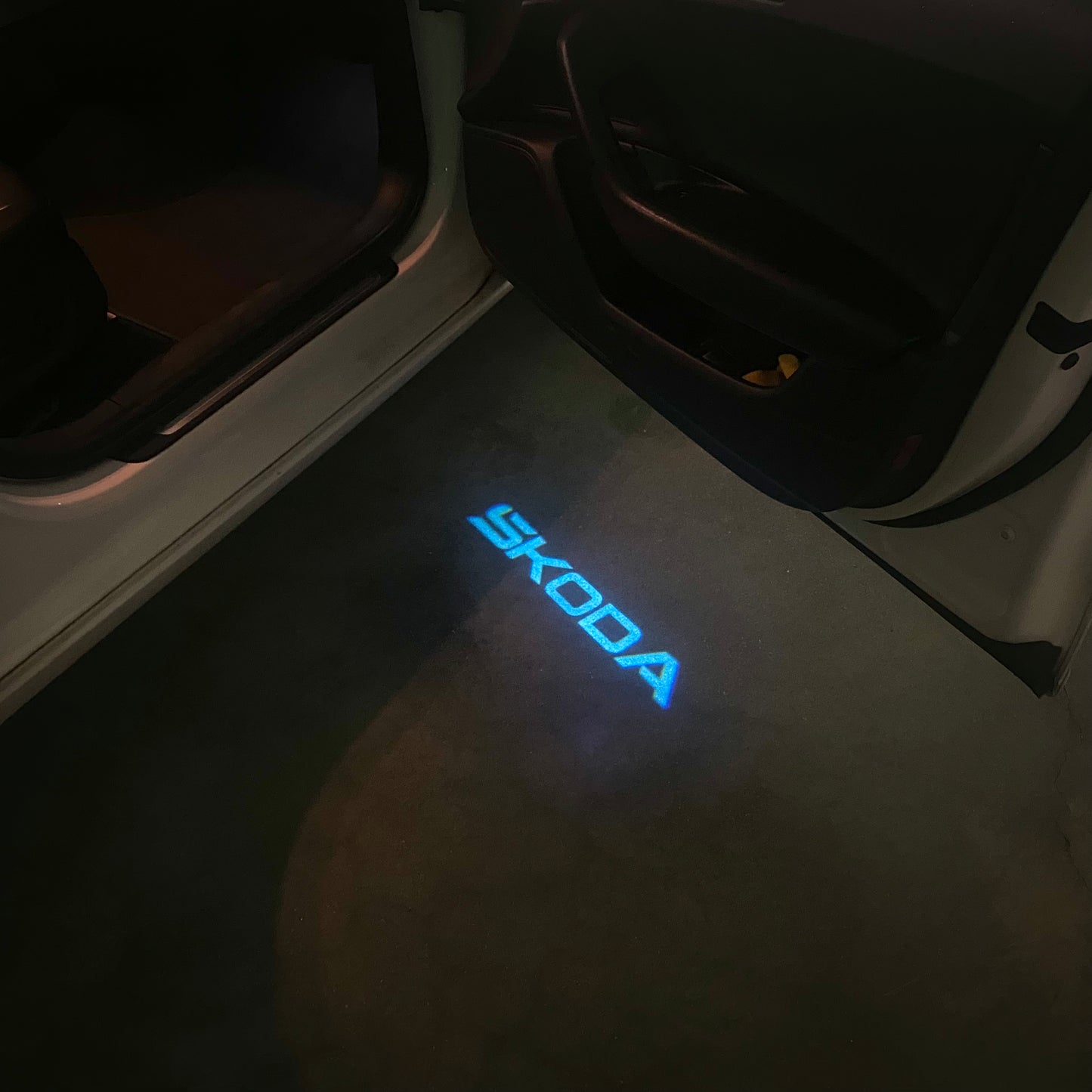 SKODA ORIGINAL LOGO PROJECTOT LIGHTS Nr.857(quantity 1 = 2 Logo Film / 2 door lights)