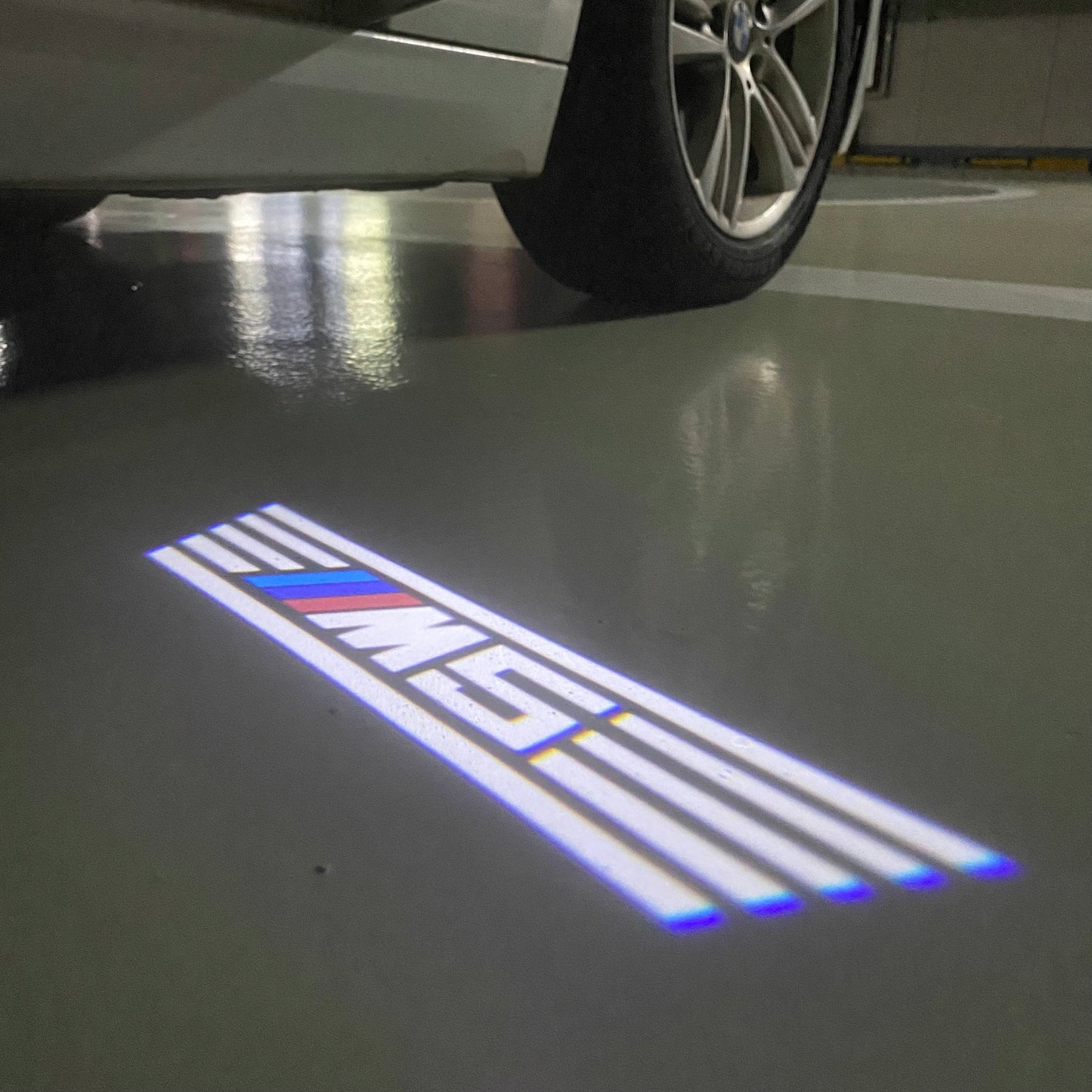 BMW 5 SERIES M5 LOGO PROJECTOT LIGHTS (quantity 1 = 1 sets/2 door lights) Nr.6024q67