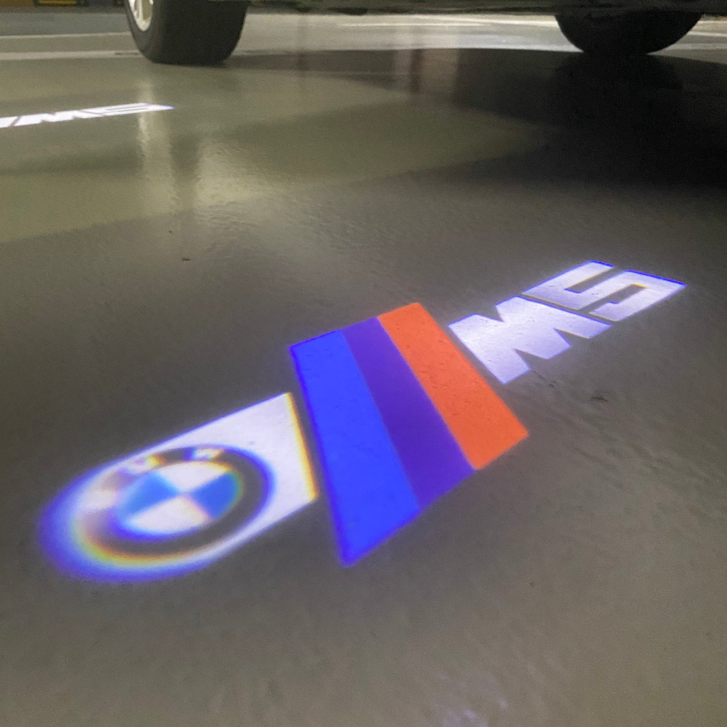 BMW 5 SERIES M5 LOGO PROJECTOT LIGHTS (quantity 1 = 1 sets/2 door lights) Nr.6024q65