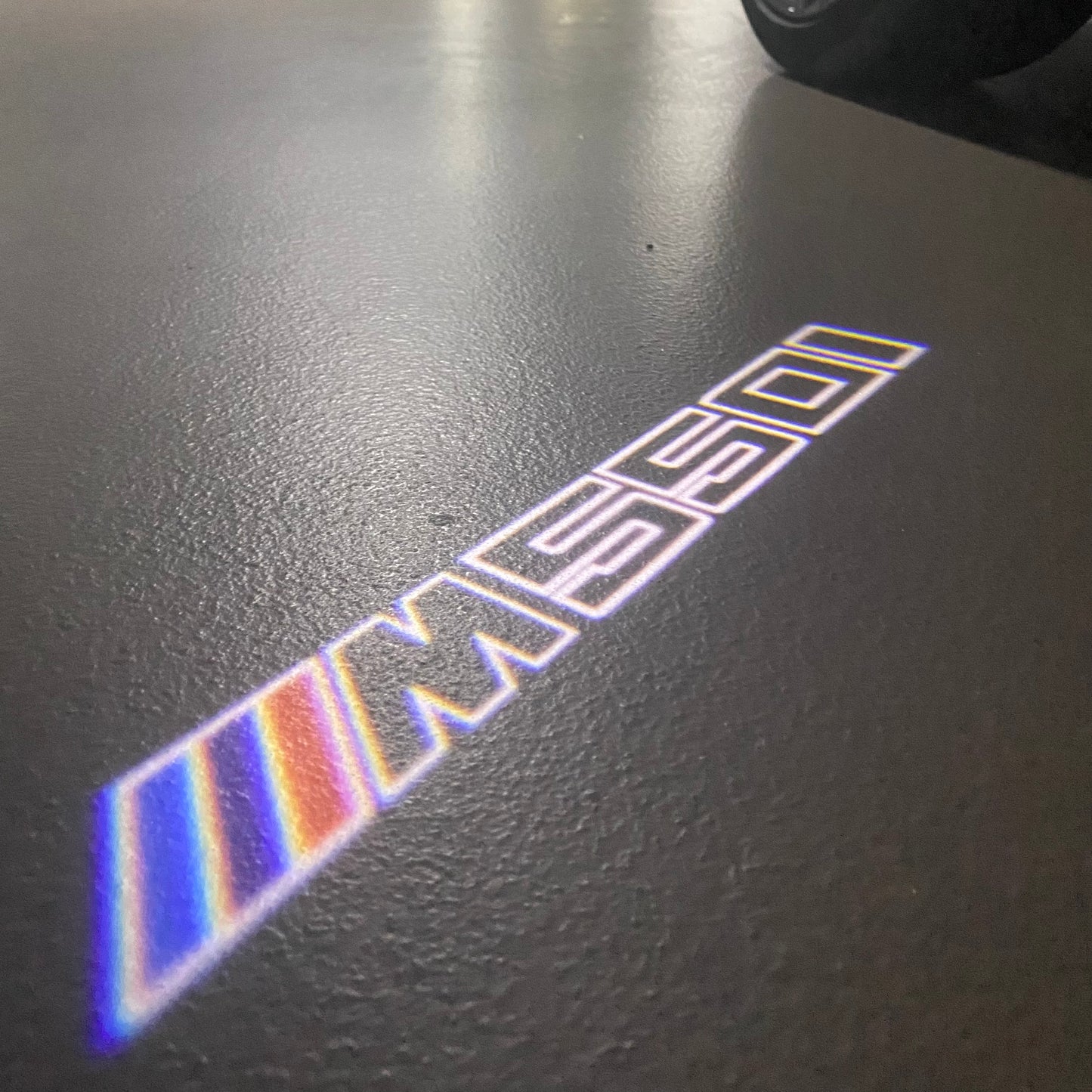 BMW 5 SERIES M550 i LOGO PROJECTOT LIGHTS (quantity 1 = 1 sets/2 door lights) Nr.6024q93
