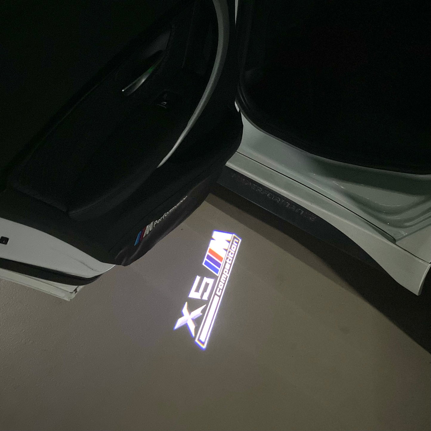 BMW X5M LOGO PROJECTOT LIGHTS (quantity 1 = 1 sets/2 door lights) Nr.6024q0t049
