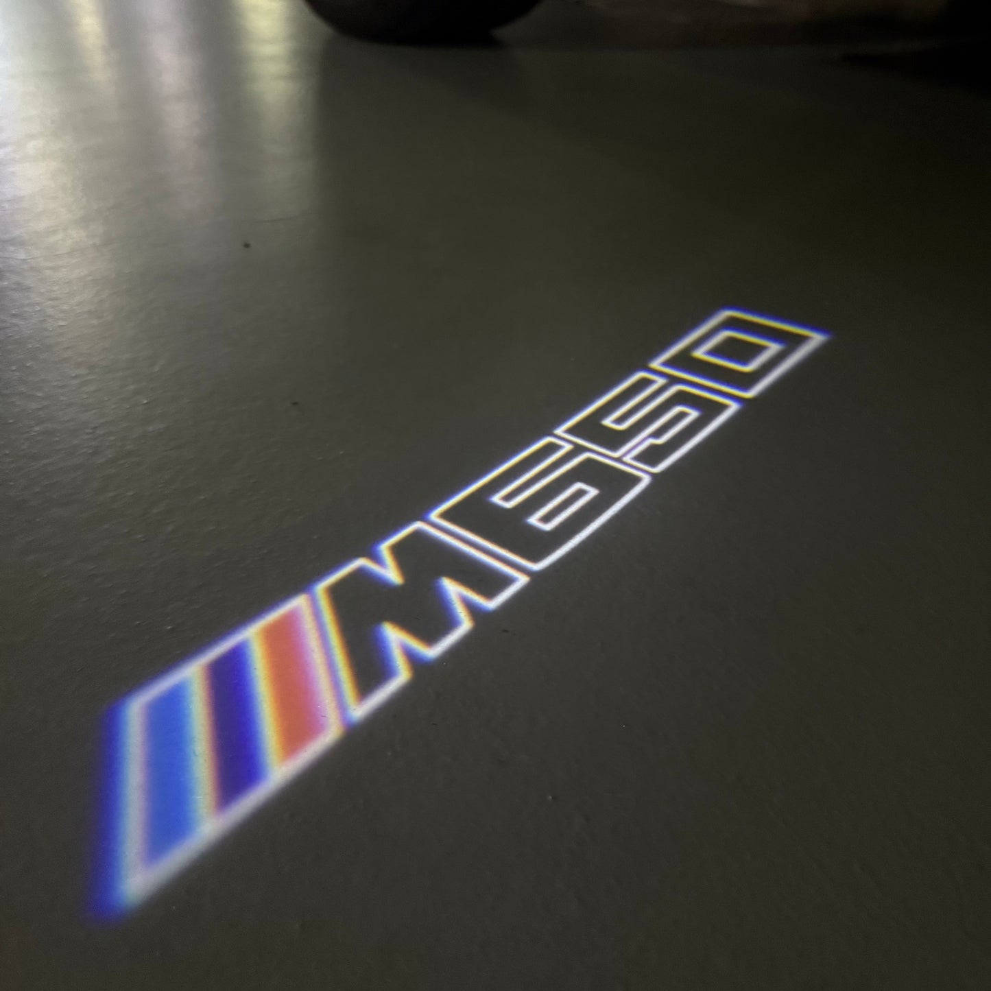 BMW 6 SERIES M650 LOGO PROJECTOT LIGHTS (quantity 1 = 1 sets/2 door lights) Nr.6024S27