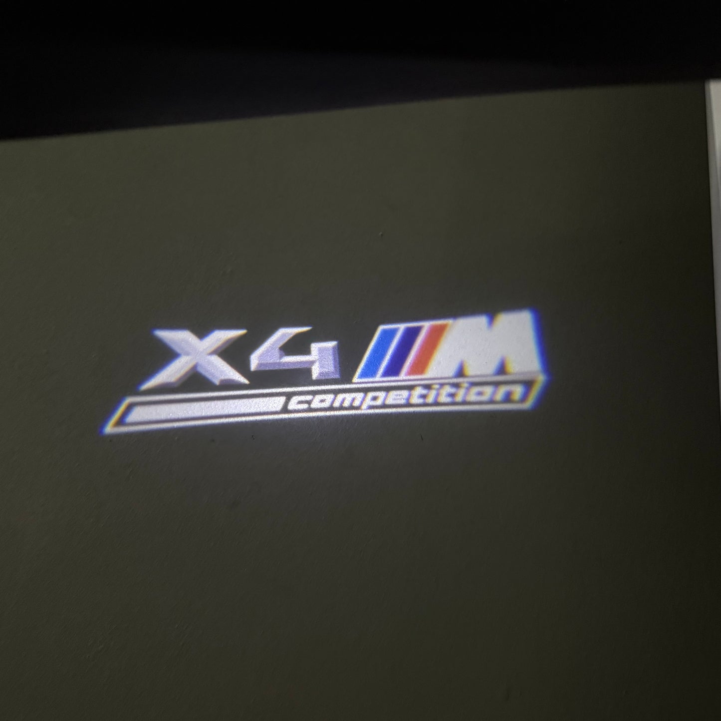 BMW X4M LOGO PROJECTOT LIGHTS (quantity 1 = 1 sets/2 door lights) Nr.6024q0t042