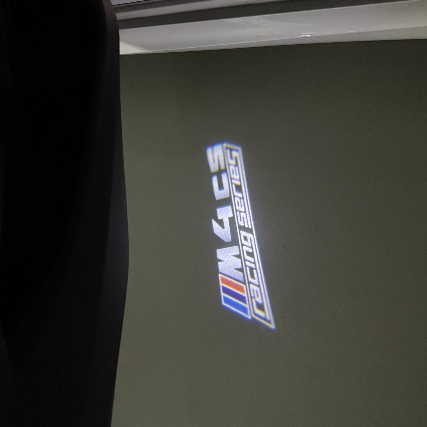 BMW 4 SERIES M4 LOGO PROJECTOT LIGHTS (quantity 1 = 1 sets/2 door lights) Nr.6024q49