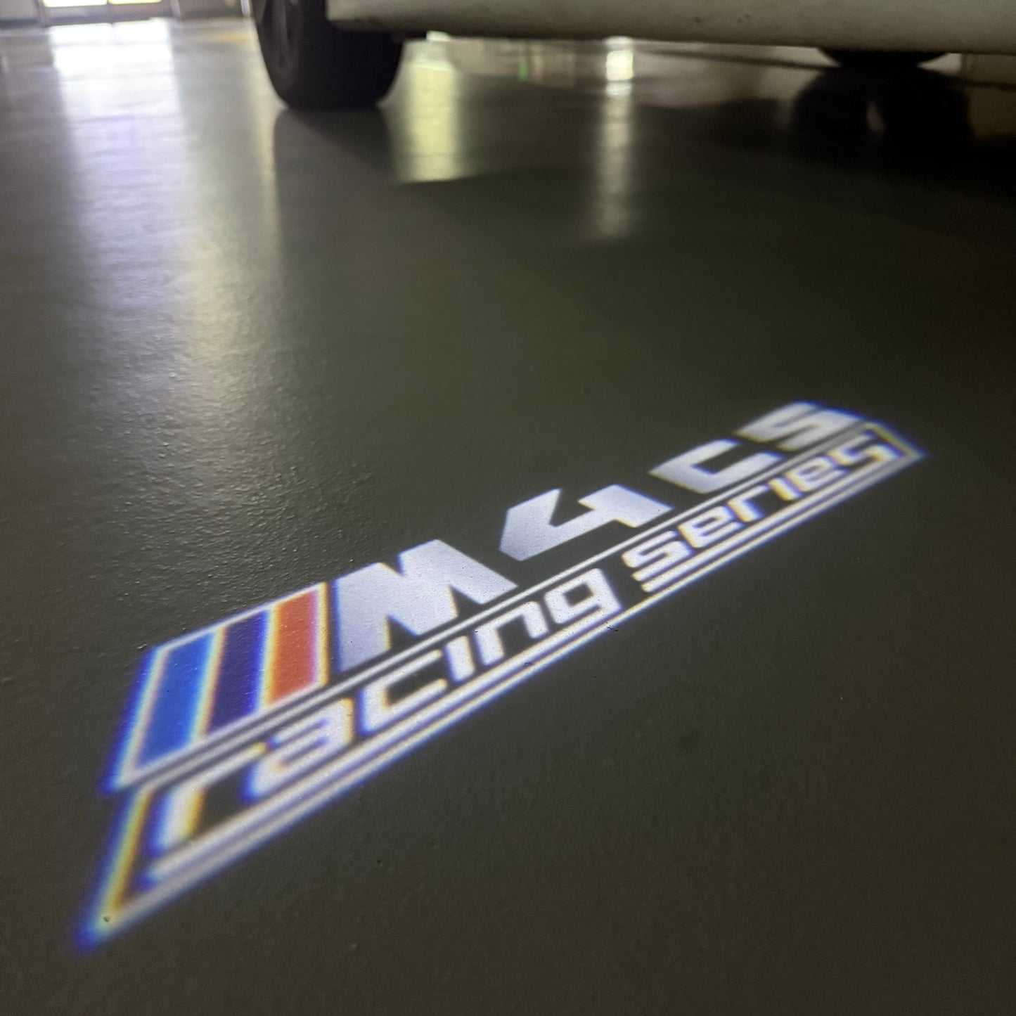 BMW 4 SERIES M4 LOGO PROJECTOT LIGHTS (quantity 1 = 1 sets/2 door lights) Nr.6024q49