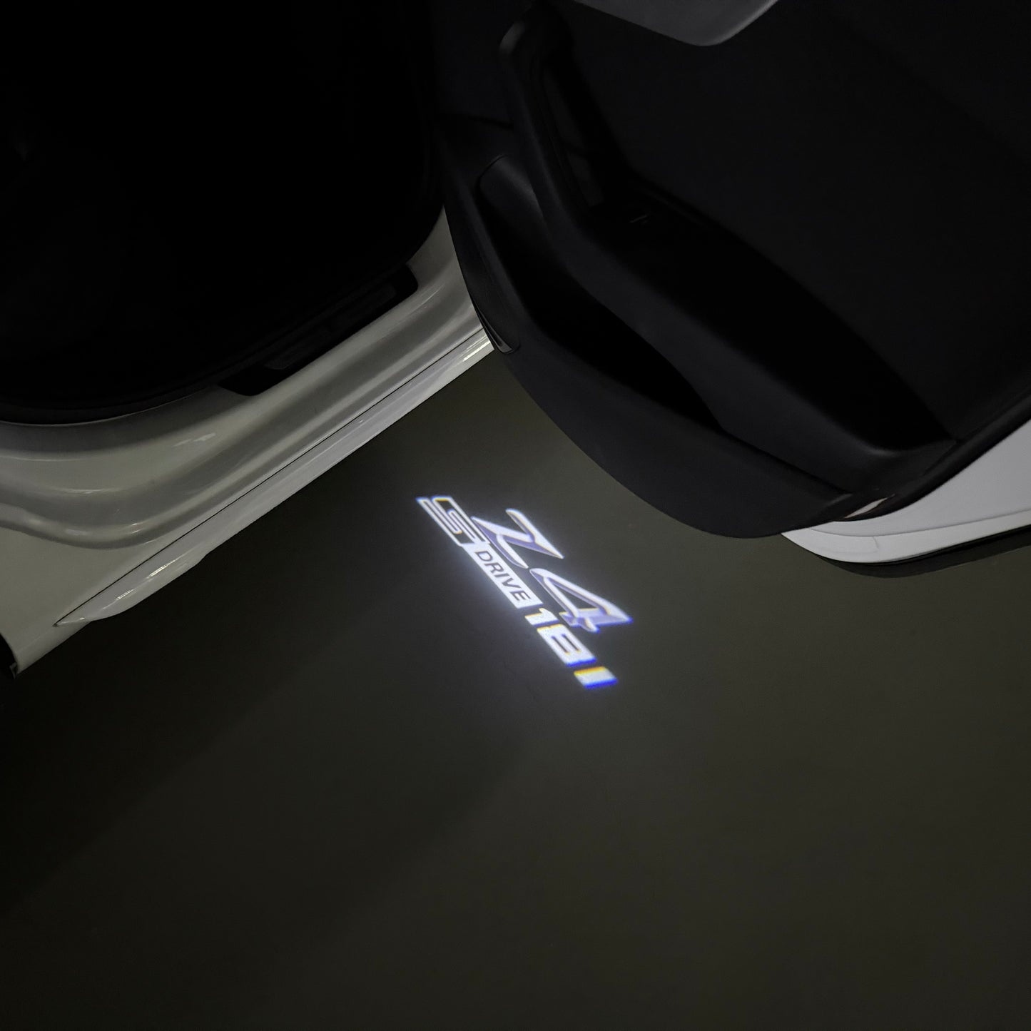 BMW Z4 S drive LOGO PROJECTOT LIGHTS (quantity 1 = 1 sets/2 door lights) Nr.6024q0t0129