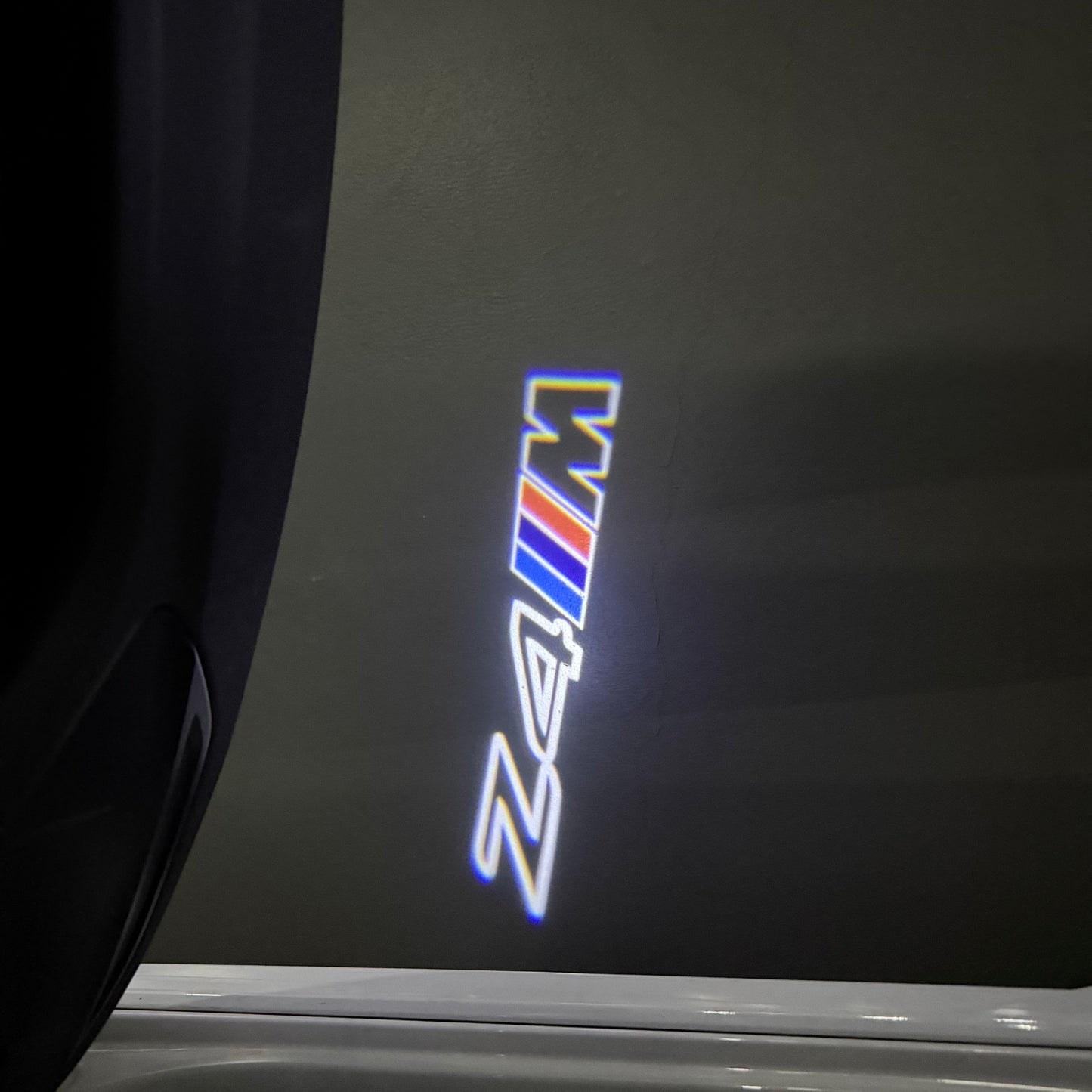 BMW Z4M LOGO PROJECTOT LIGHTS (quantity 1 = 1 sets/2 door lights) Nr.6024q0t0132
