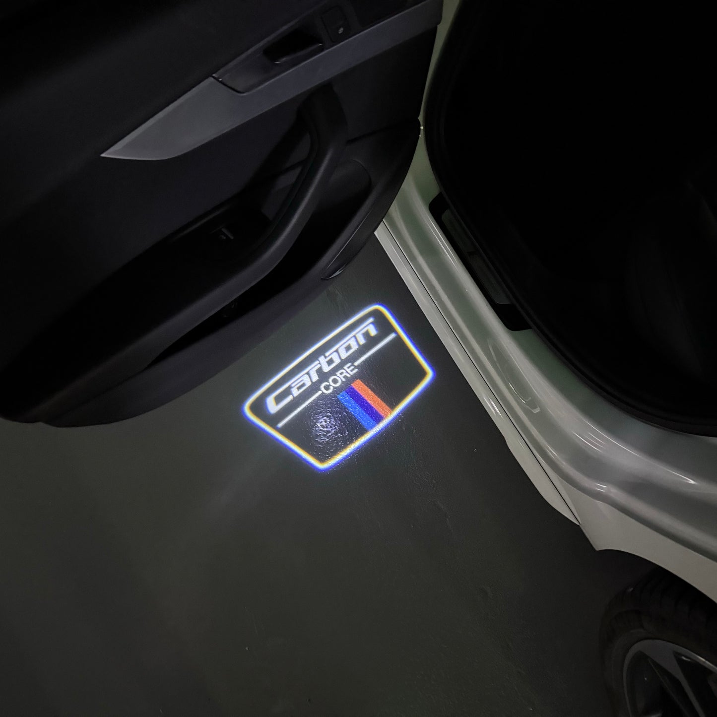 BMW Carbon LOGO PROJECTOT LIGHTS (quantity 1 = 1 sets/2 door lights) Nr.6024q177
