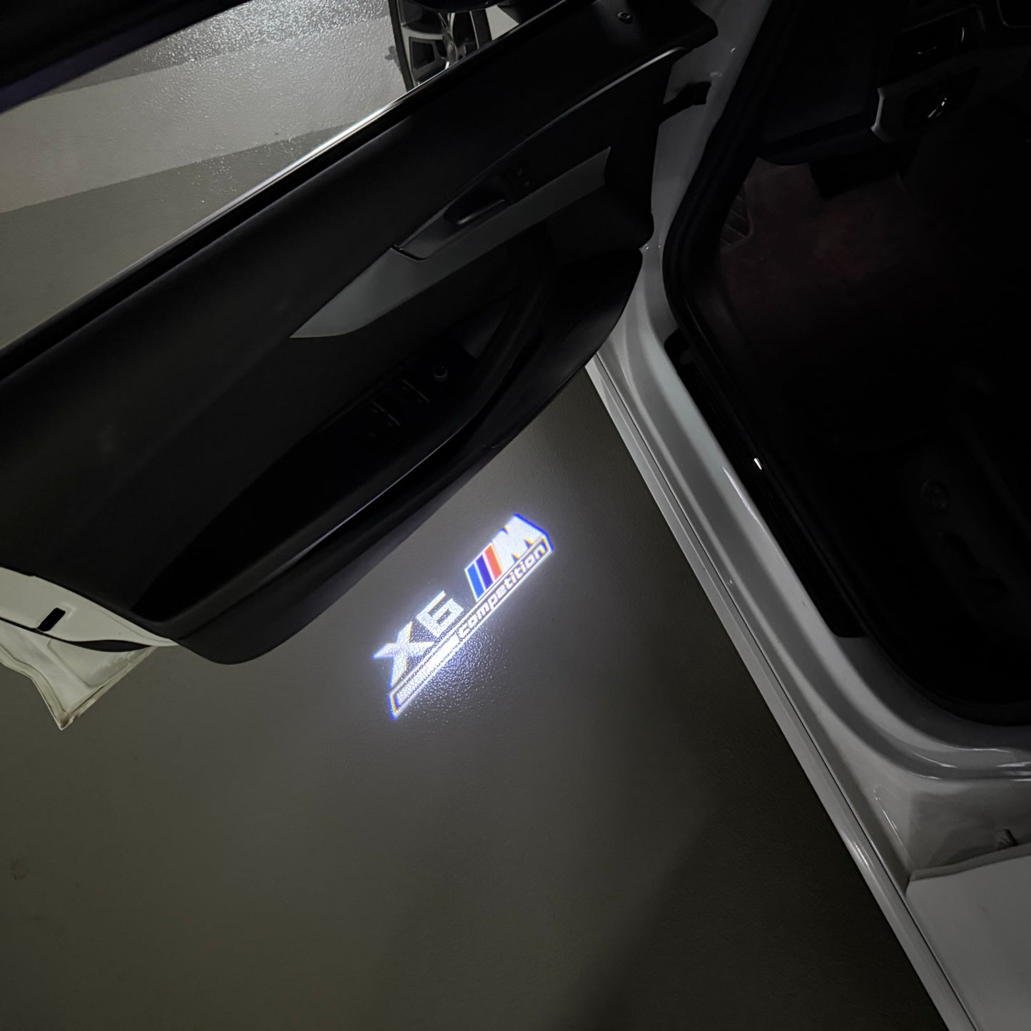 BMW X6M LOGO PROJECTOT LIGHTS (quantity 1 = 1 sets/2 door lights) Nr.6024q0t054