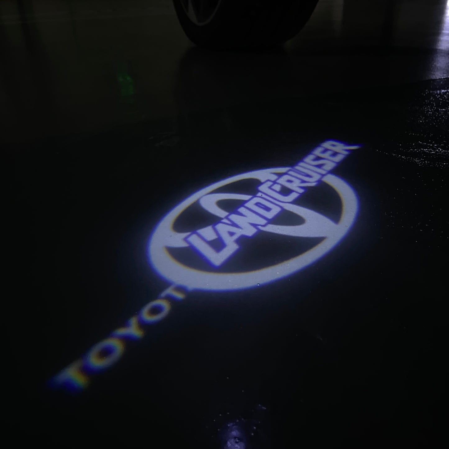 TOYOTA LAND CRUISER LOGO PROJECROTR LIGHTS (quantity 1 = 1 sets/2 door lights) Nr.0GP39