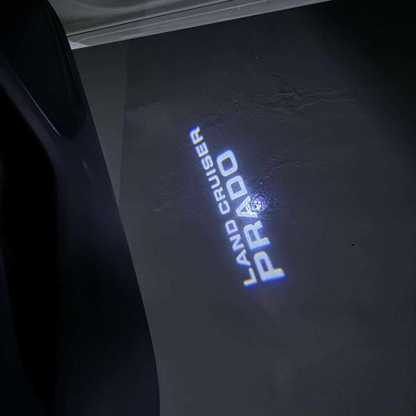 TOYOTA PRADO LOGO PROJECROTR LIGHTS (quantity 1 = 1 sets/2 door lights) Nr.0G13