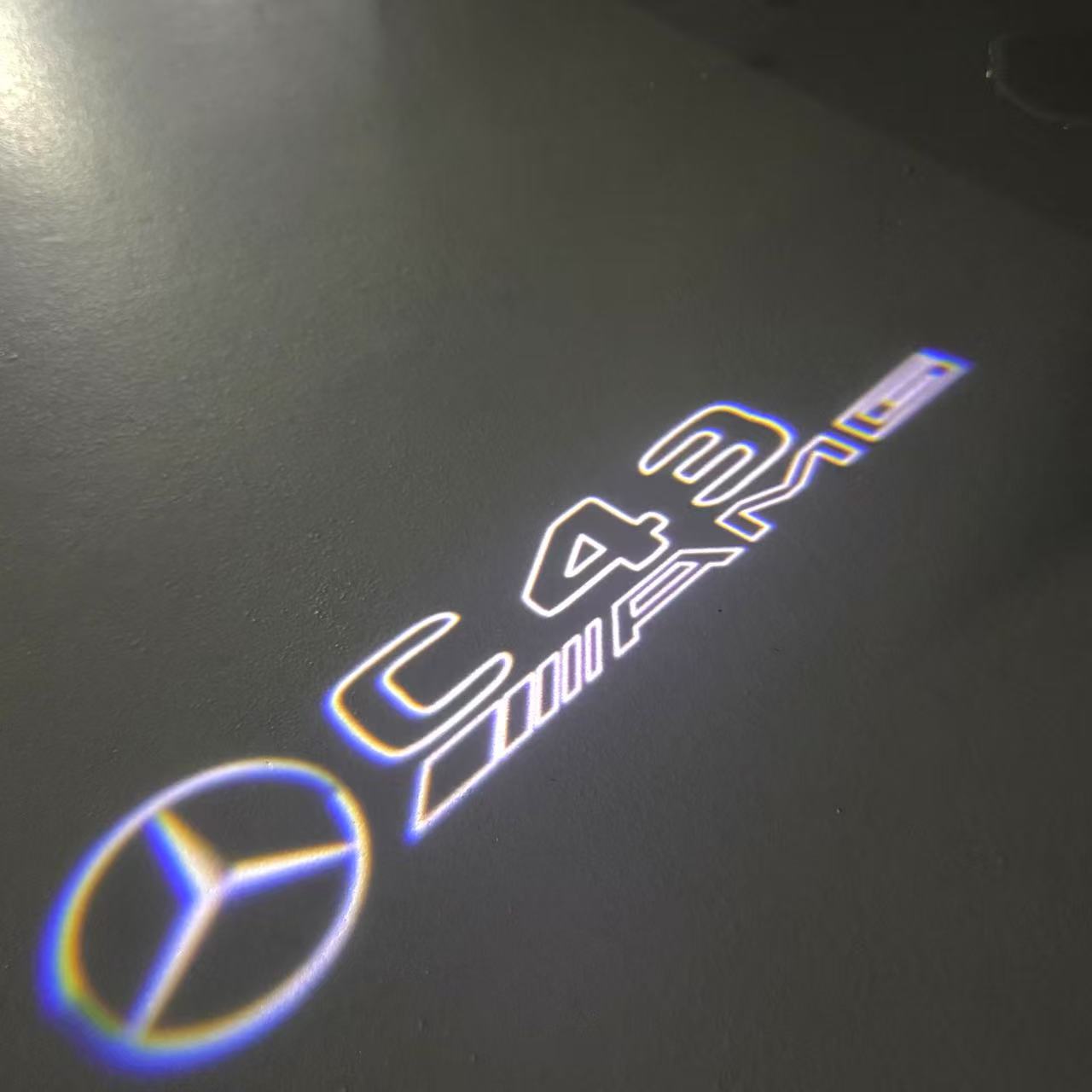 MERCEDES BENZ C43 AMG LOGO PROJECTOT LIGHTS (quantity 1 = 1 sets/2 door lights)Nr.03f04