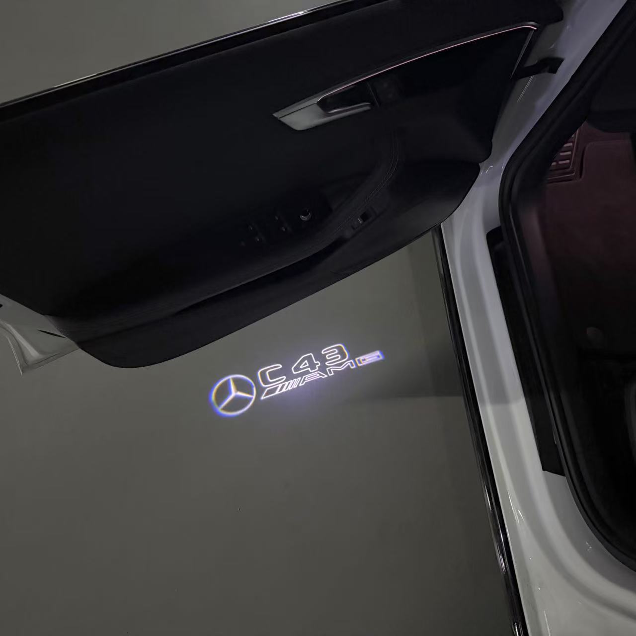 MERCEDES BENZ C43 AMG LOGO PROJECTOT LIGHTS (quantity 1 = 1 sets/2 door lights)Nr.03f04