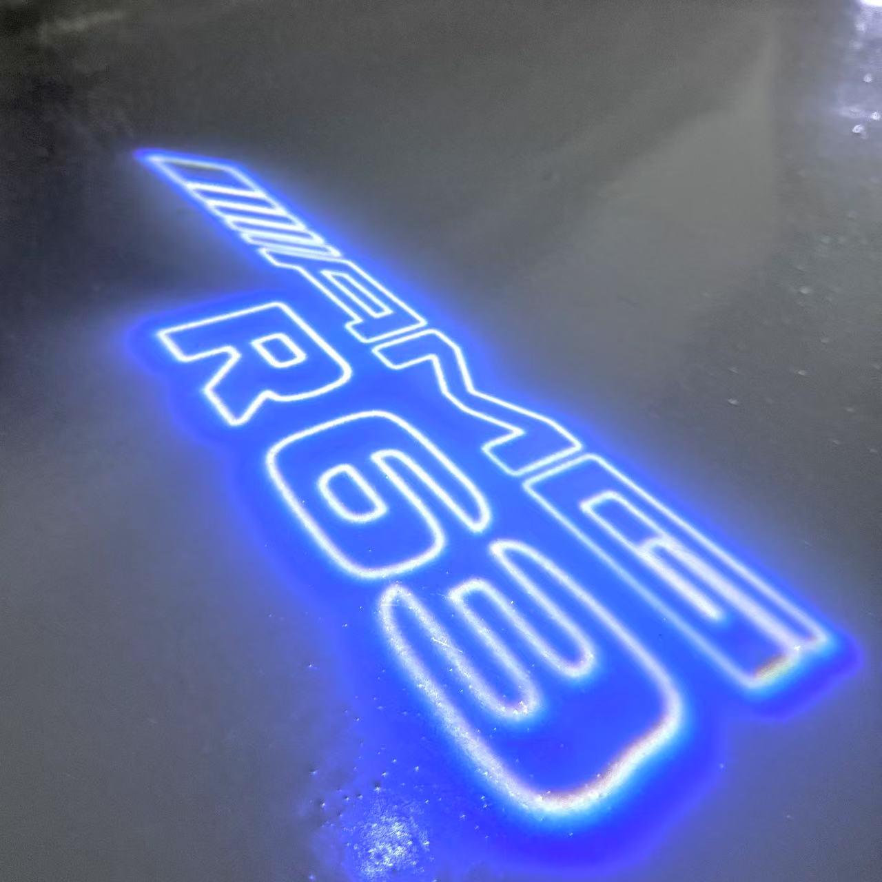 MERCEDES BENZ R 63 AMG LOGO PROJECTOR LIGHTS (quantity 1 = 1 sets/2 door lights)Nr.03f045