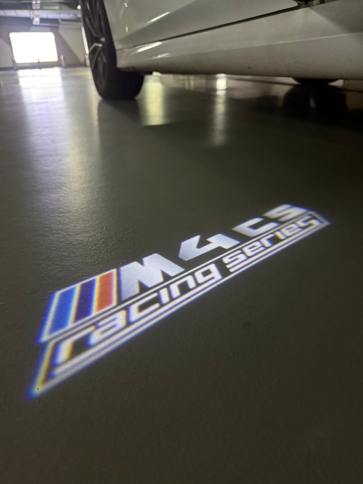 BMW 4 SERIES M4 LOGO PROJECTOT LIGHTS (quantity 1 = 1 sets/2 door lights) Nr.6024q49