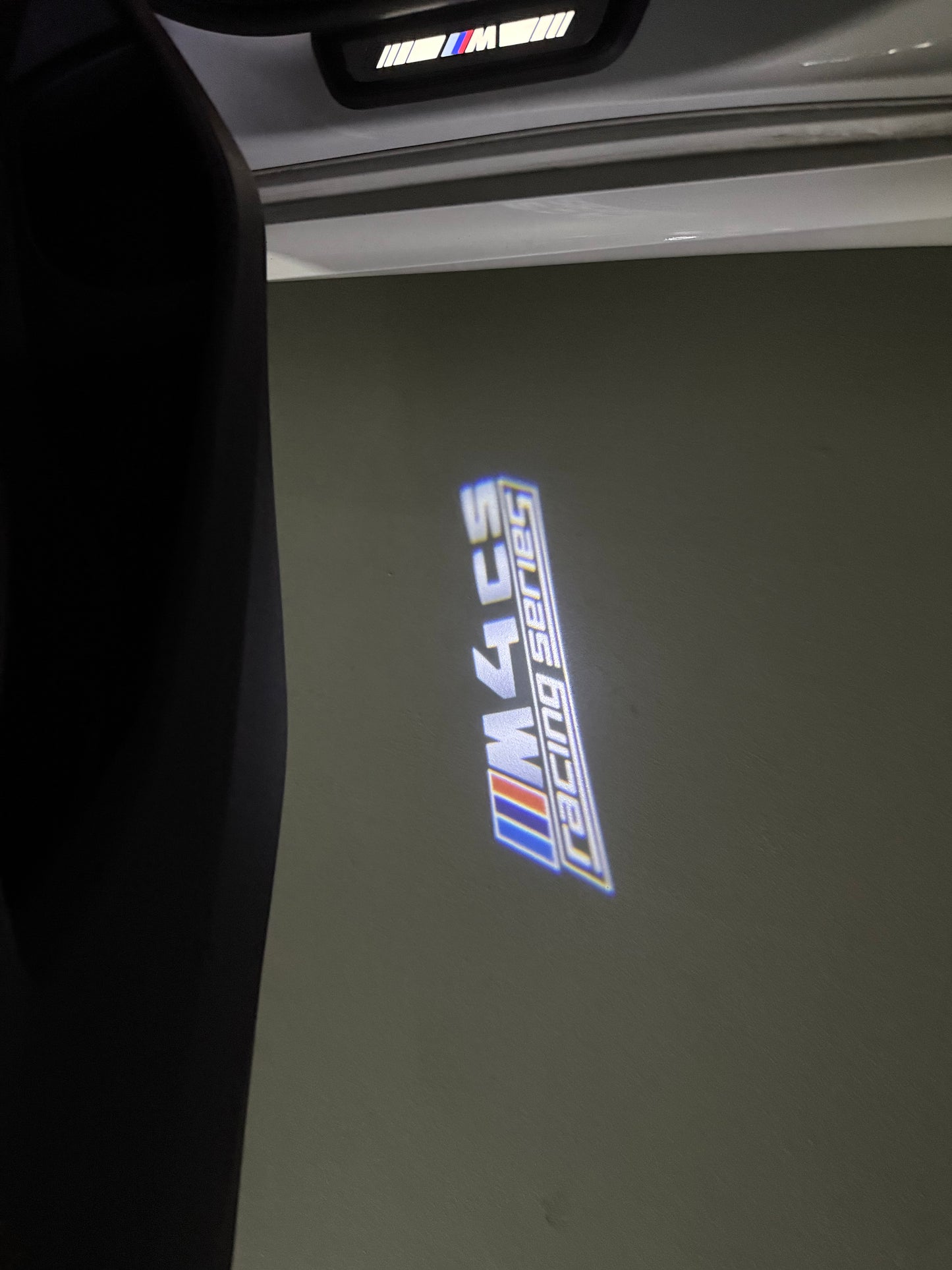 BMW 4 SERIES M4 LOGO PROJECTOT LIGHTS (quantity 1 = 1 sets/2 door lights) Nr.6024q49