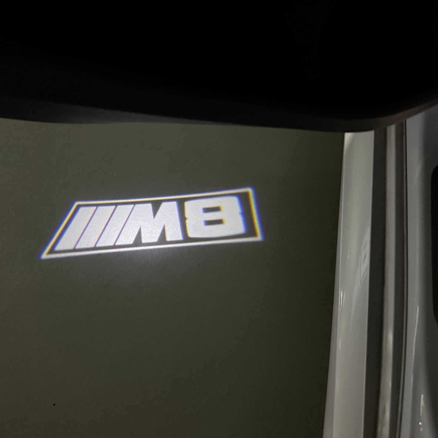 BMW 8 SERIES M8 LOGO PROJECTOT LIGHTS (quantity 1 = 1 sets/2 door lights) Nr.6024q107