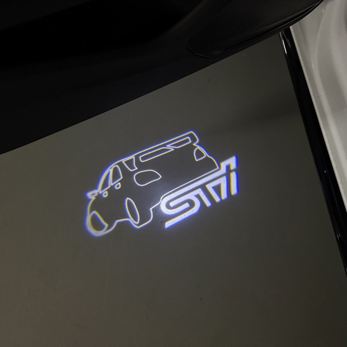 SUBARU IMPREZA STI LOGO PROJECROTR LIGHTS (quantity 1 = 1 sets/2 door lights) Nr.03A25