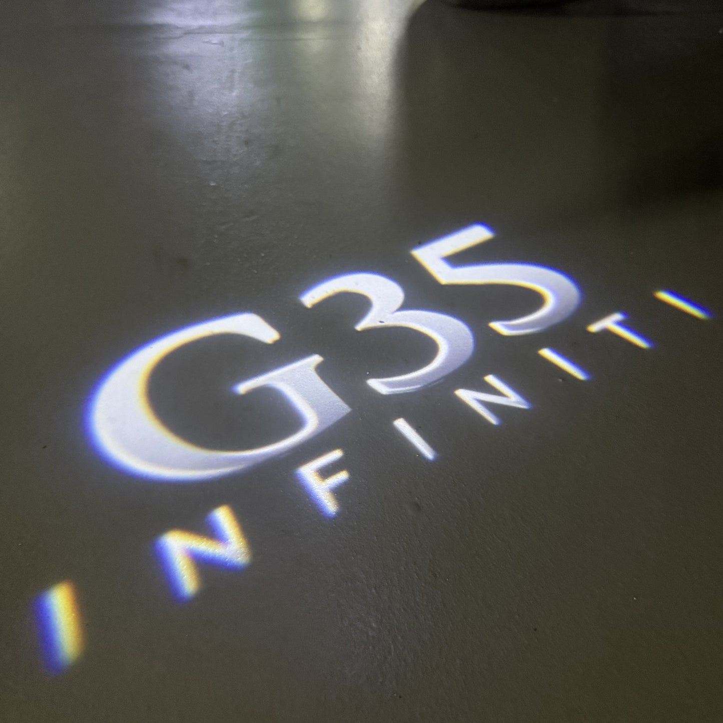 INFINITI G35 LOGO PROJECROTR LIGHTS (quantity 1 = 1 sets/2 door lights)Nr.74A56