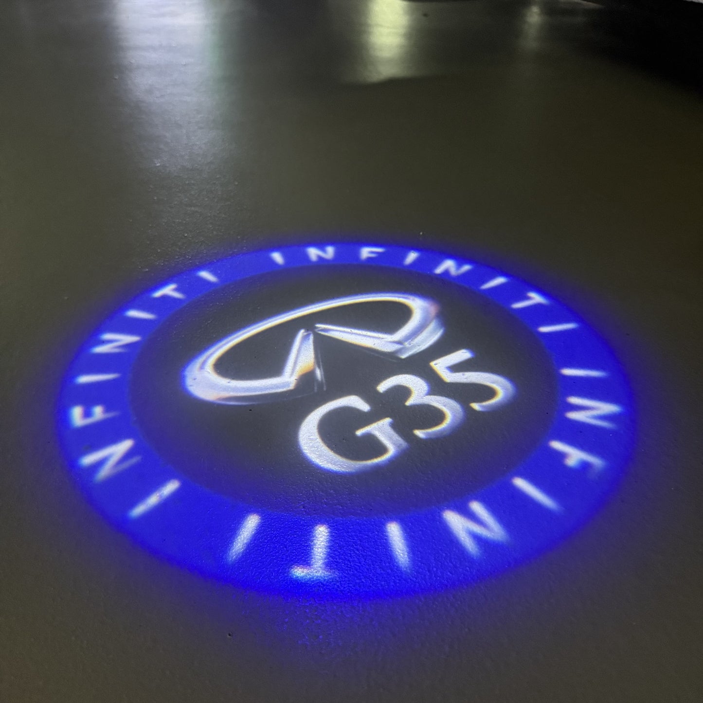 INFINITI G35 LOGO PROJECROTR LIGHTS (quantity 1 = 1 sets/2 door lights)Nr.74A58