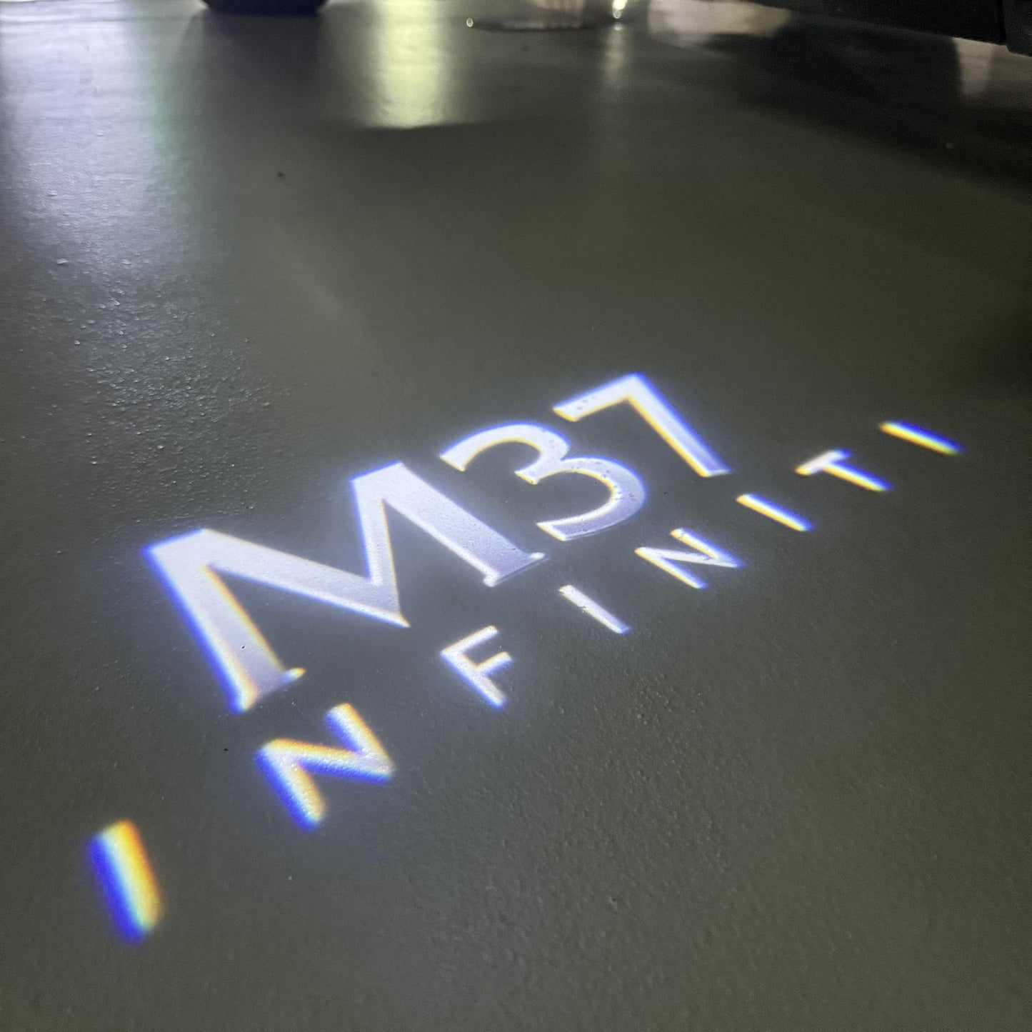INFINITI M37 LOGO PROJECROTR LIGHTS (quantity 1 = 1 sets/2 door lights)Nr.74A87