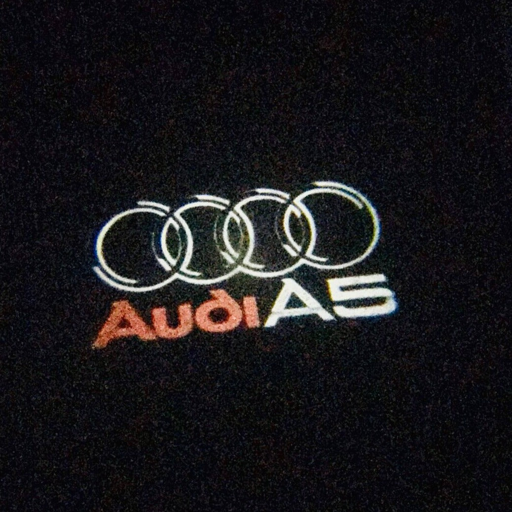 AUDI A5 LOGO PROJECTOT LIGHTS Nr.43 (quantity 1 = 2 Logo Films /2 door lights)