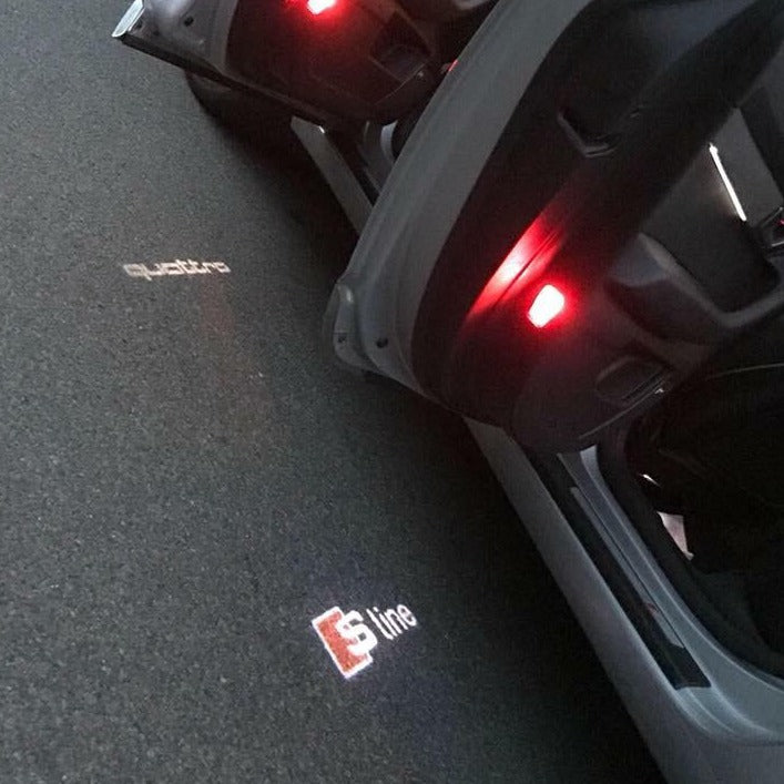 AUDI S LINE LOGO PROJECTOT LIGHTS Nr.100 (quantity 1 = 2 Logo Films /2 door lights)