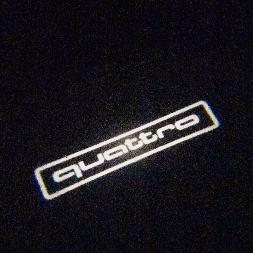 AUDI QUATTRO LOGO PROJECTOT LIGHTS Nr.85 (quantity 1 = 2 Logo Films /2 door lights)