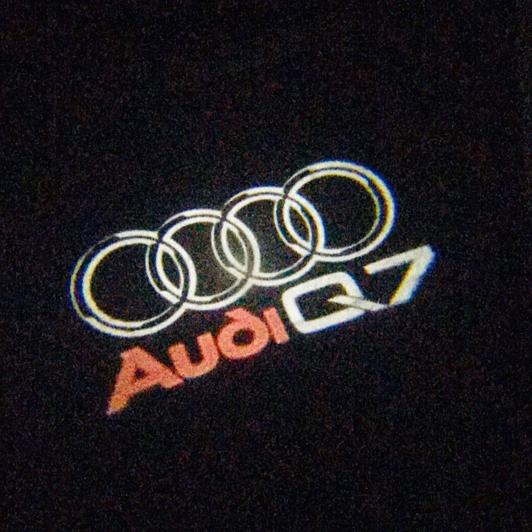 AUDI Q7 LOGO PROJECTOT LIGHTS Nr.49 (quantity 1 = 2 Logo Films /2 door lights)