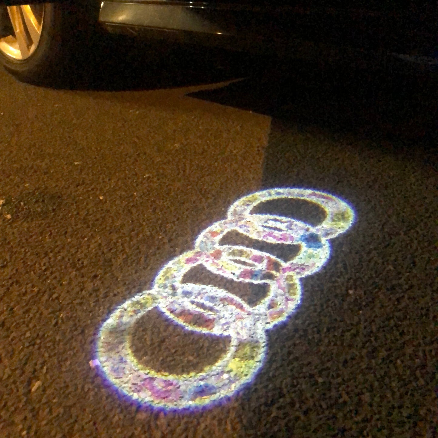 AUDI 4 RINGS LOGO PROJECTOT LIGHTS Nr.10 (quantity 1 = 2 Logo Films /2 door lights)