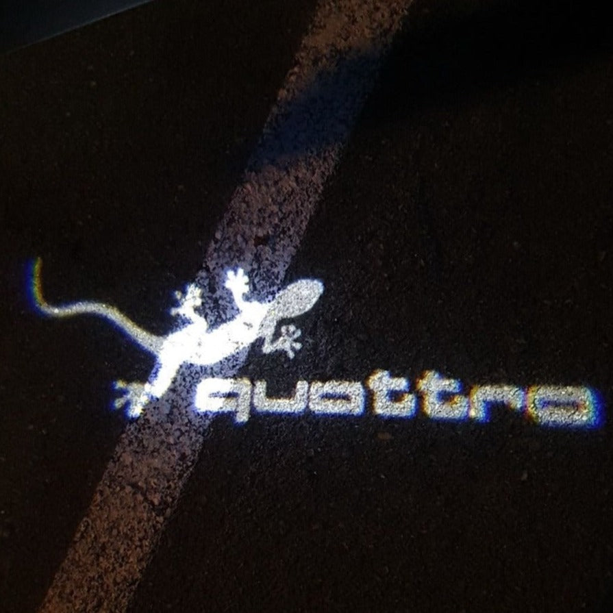AUDI QUATTRO GECKO LOGO PROJECTOT LIGHTS Nr.62 (quantity 1 = 2 Logo Films /2 door lights)