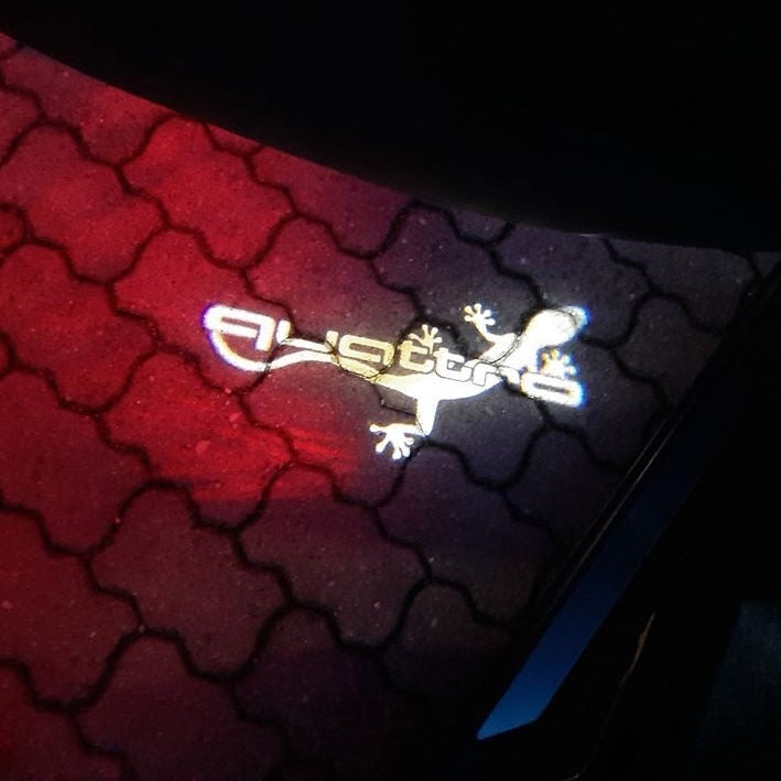 AUDI QUATTRO GECKO LOGO PROJECTOT LIGHTS Nr.64 (quantity 1 = 2 Logo Films /2 door lights)