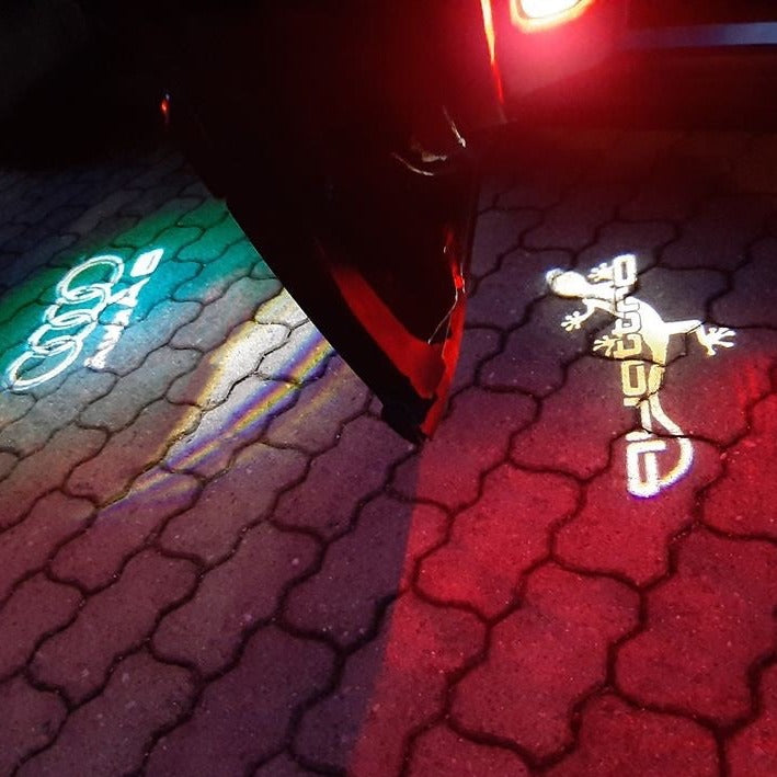 AUDI QUATTRO GECKO LOGO PROJECTOT LIGHTS Nr.64 (quantity 1 = 2 Logo Films /2 door lights)