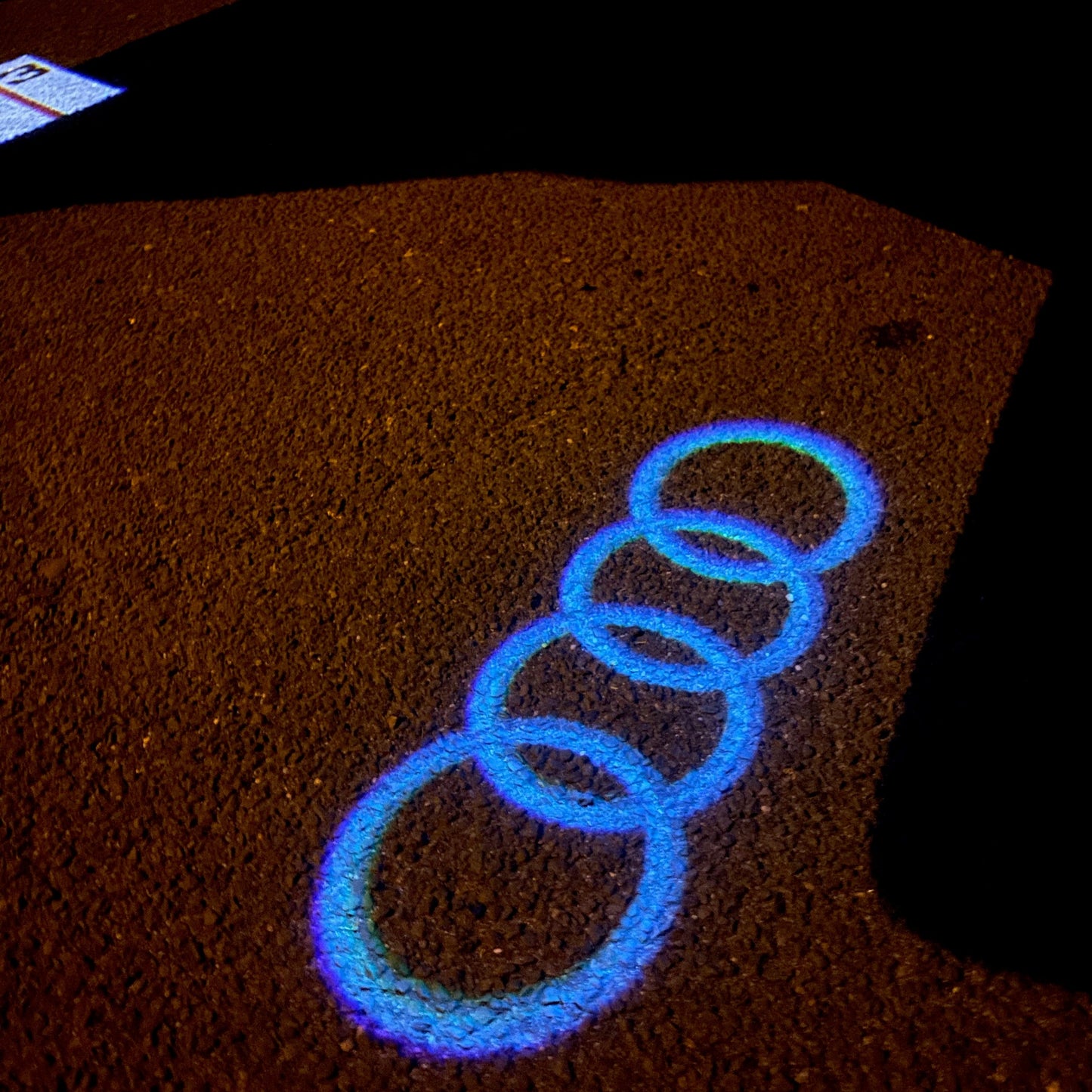 AUDI 4 RINGS LOGO PROJECTOT LIGHTS Nr.08 (quantity 1 = 2 Logo Films /2 door lights)