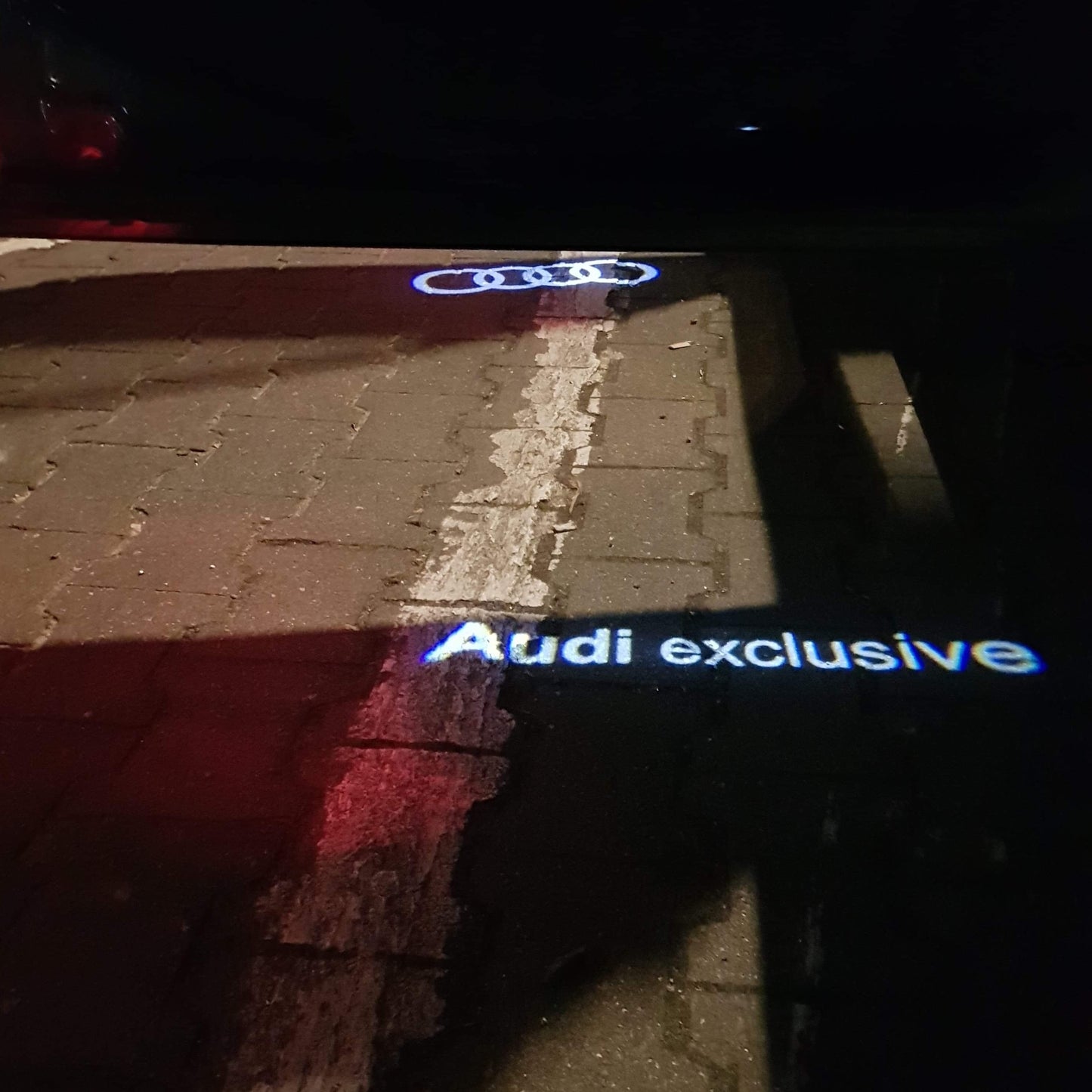 AUDI EXCLUSIVE LOGO PROJECTOT LIGHTS Nr.73 (quantity 1 = 2 Logo Films /2 door lights)
