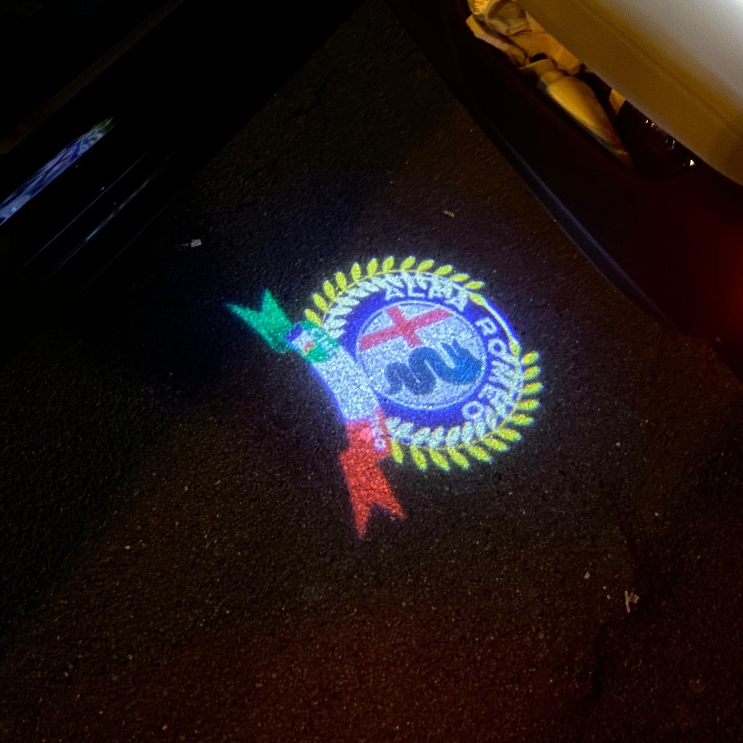 Alfa Romeo ORIGINAL Multicolour LOGO PROJECTOT LIGHTS Nr.54 (quantity 1 = 2 Logo Film / 2 door lights)