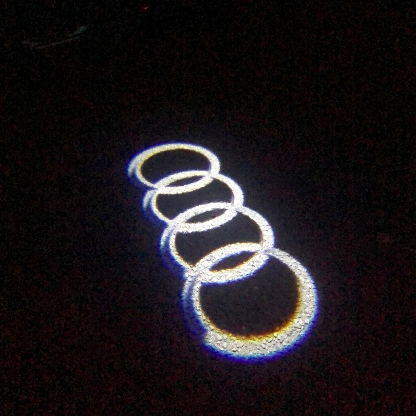 AUDI 4 RINGS LOGO PROJECTOT LIGHTS Nr.04 (quantity 1 = 2 Logo Films /2 door lights)