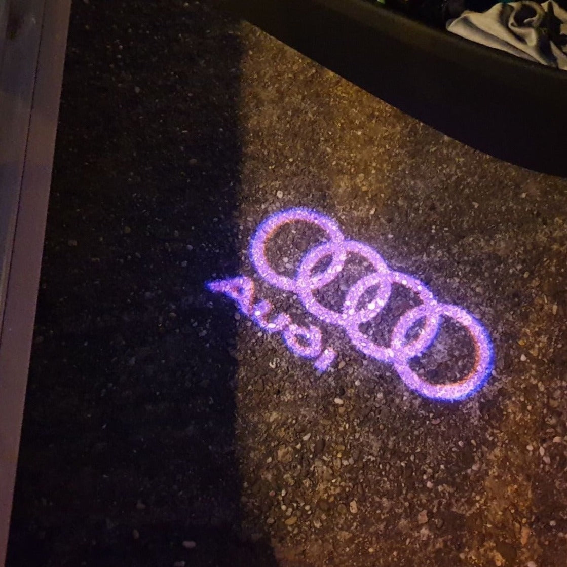 AUDI Original LOGO PROJECTOT LIGHTS Nr.003 (quantity 1 = 2 Logo Films /2 door lights)
