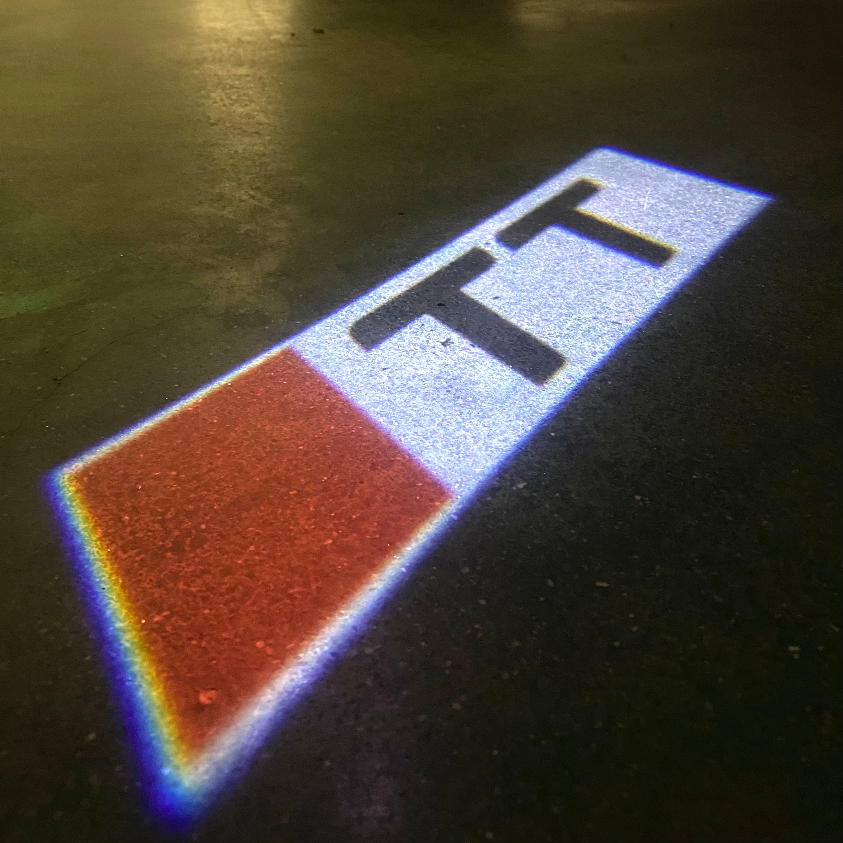 AUDI  TT  LOGO PROJECTOT LIGHTS  (quantity 1 = 2 Logo Films /2 door lights）Nr.12B53