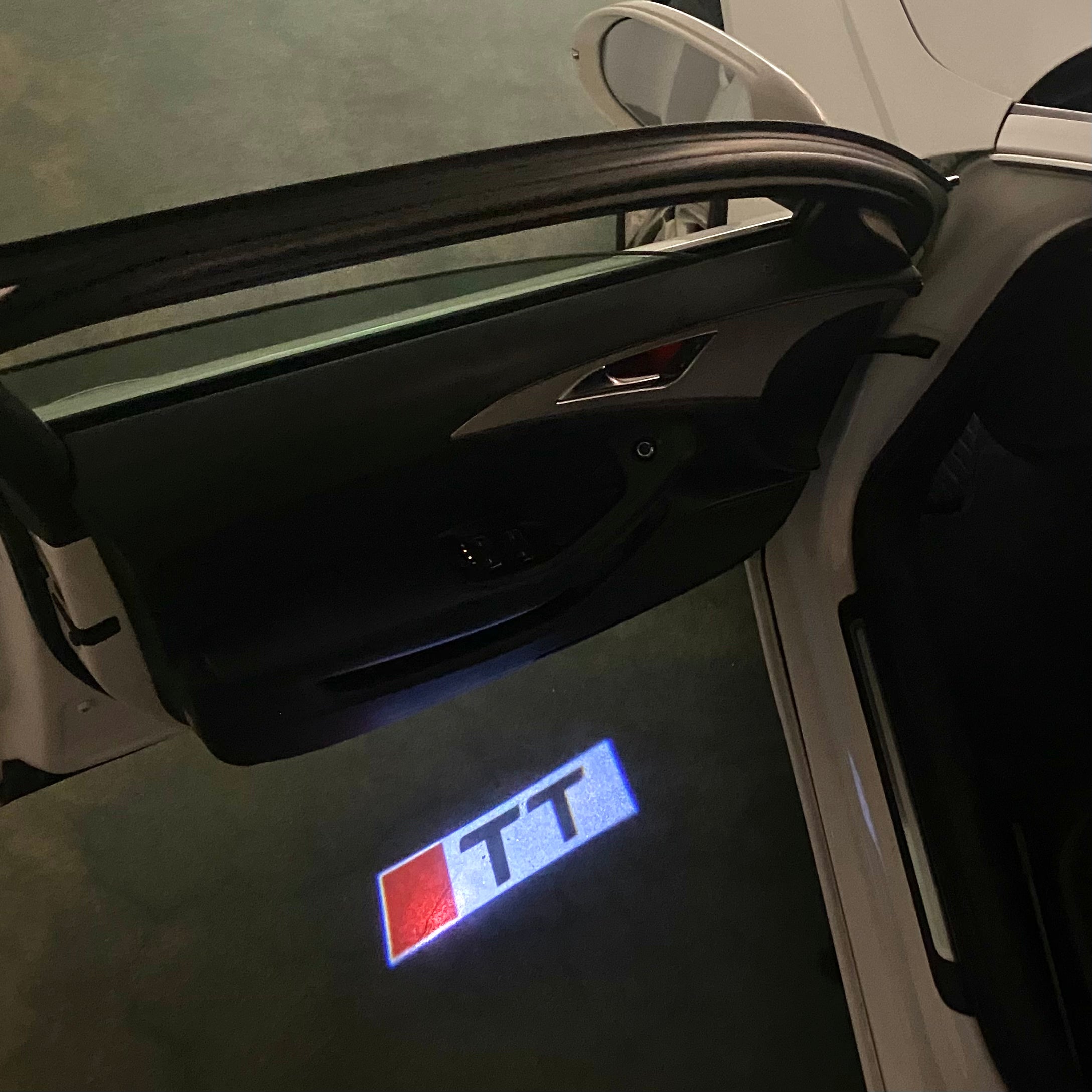 AUDI  TT  LOGO PROJECTOT LIGHTS  (quantity 1 = 2 Logo Films /2 door lights）Nr.12B53