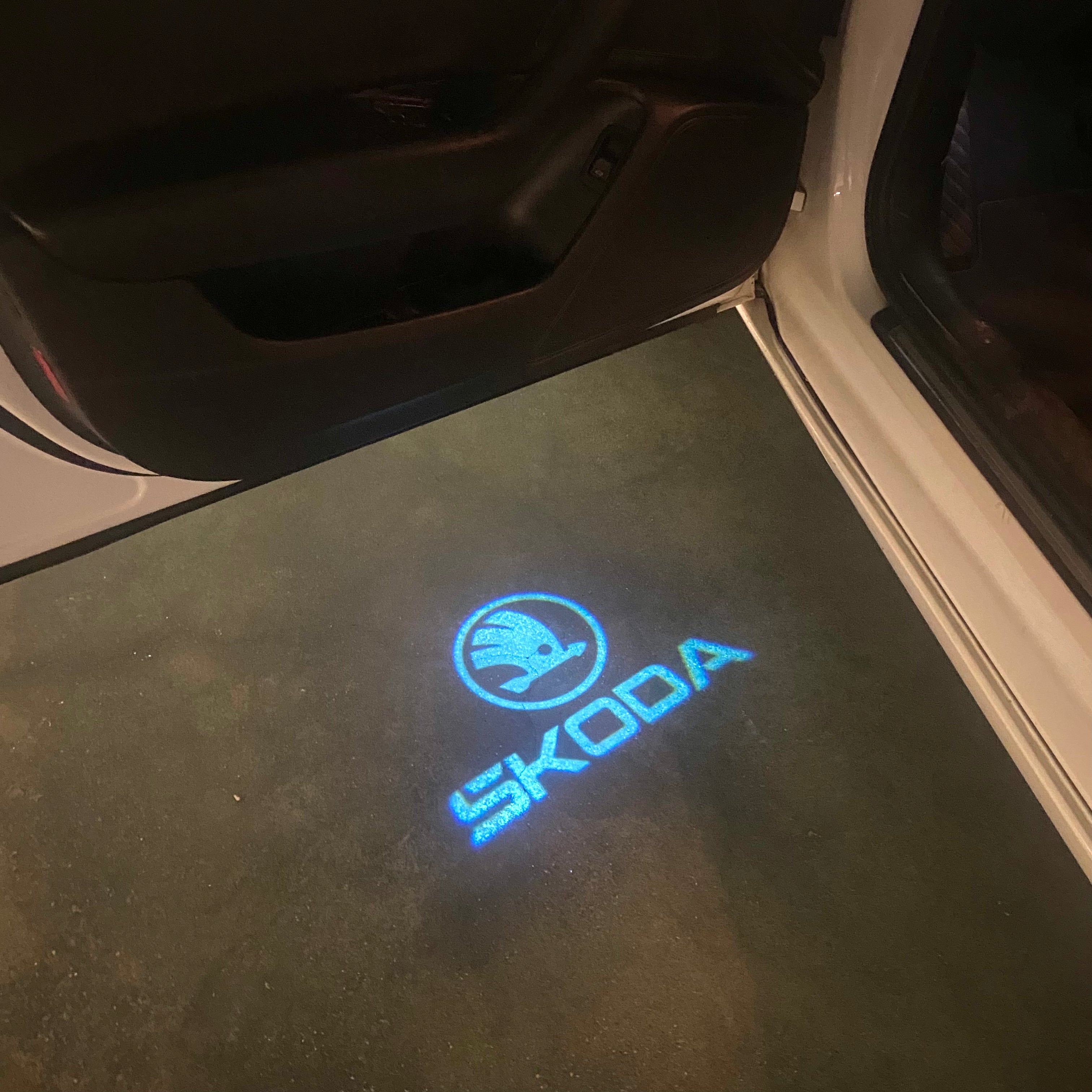 SKODA ORIGINAL LOGO PROJECTOT LIGHTS Nr.867(quantity  1 =  2 Logo Film /  2 door lights)