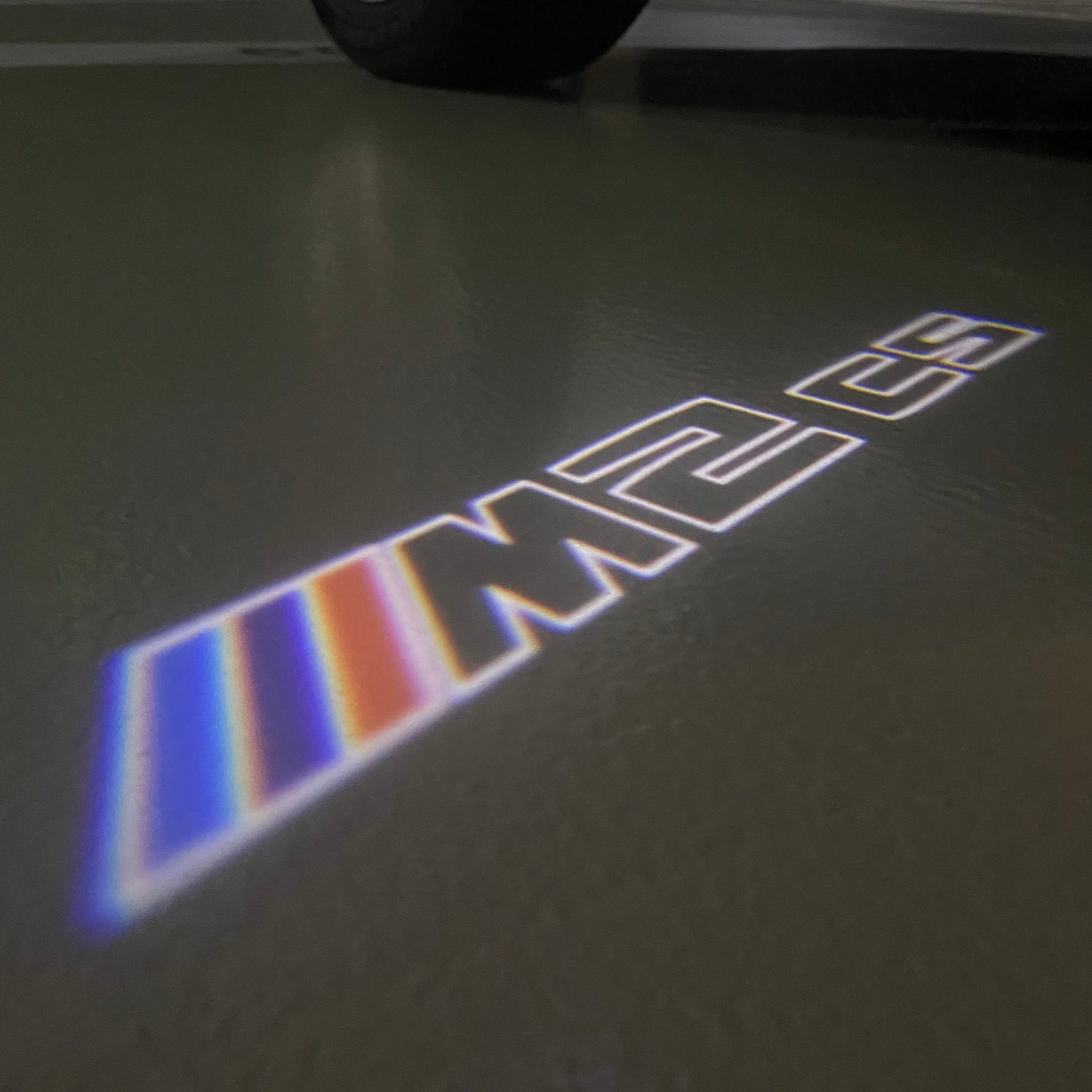 BMW  2 SERIES M2 LOGO PROJECTOT LIGHTS (quantity 1 = 1 sets/2 door lights) Nr.6024t28